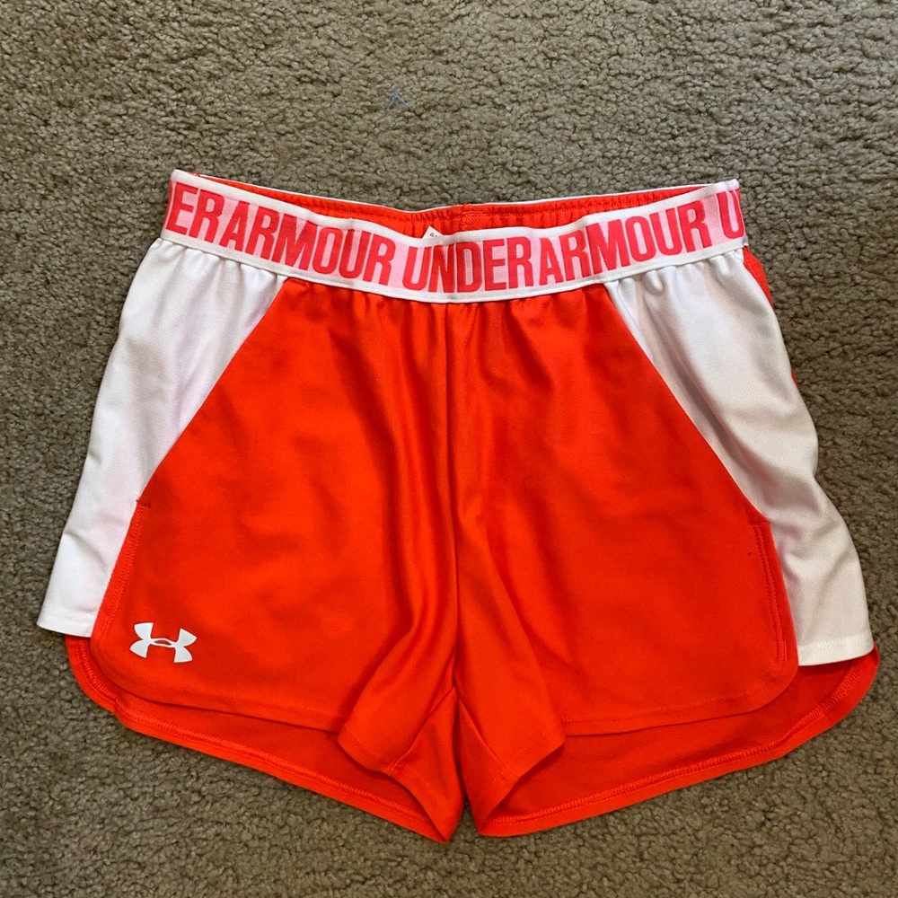 Pink athletic shorts.